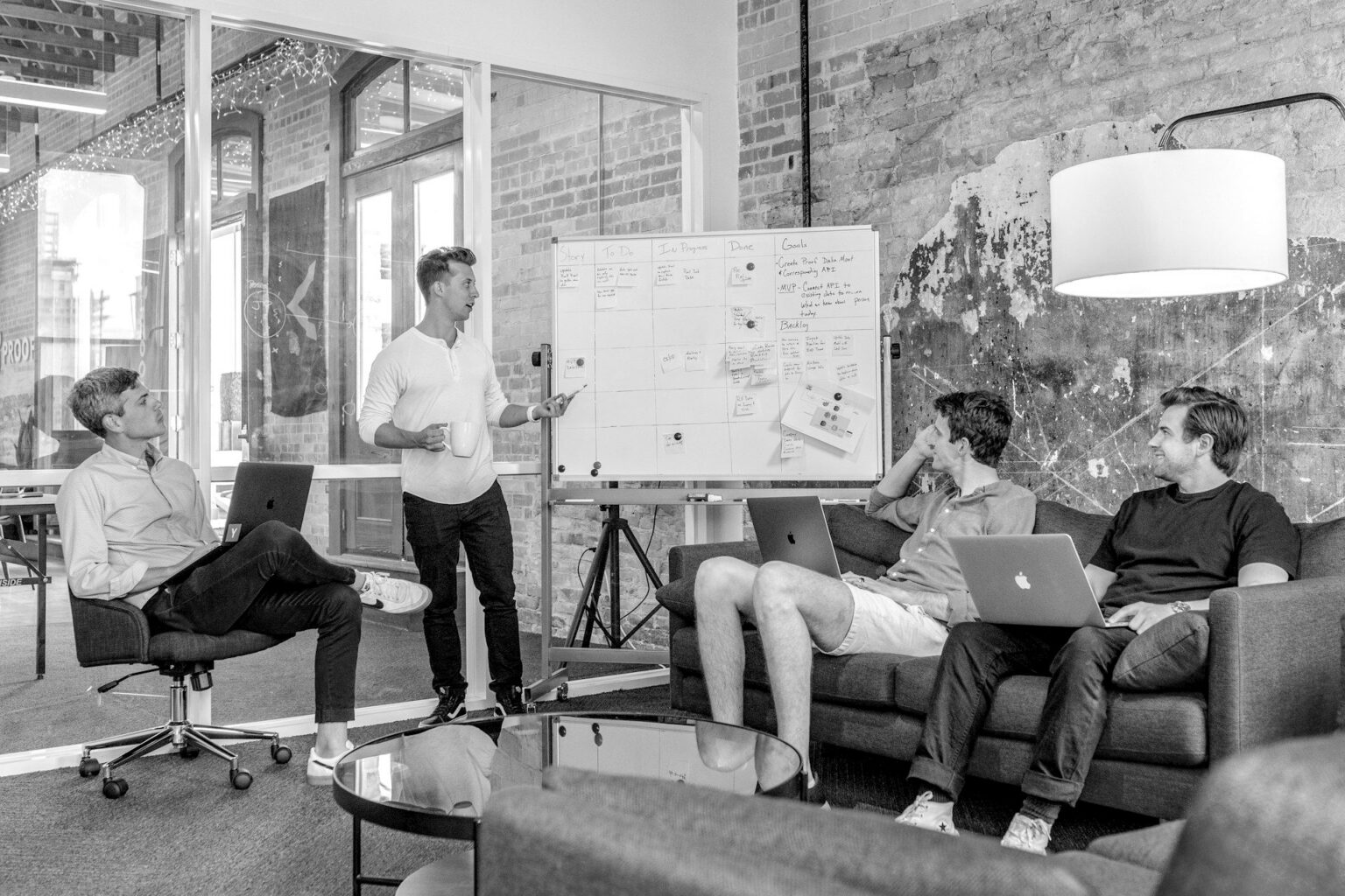 Agency team reviewing work together around a whiteboard